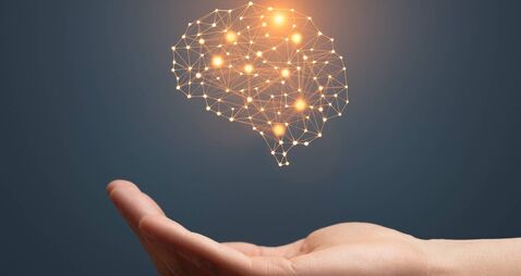 Artificial intelligence brain symbol and hand