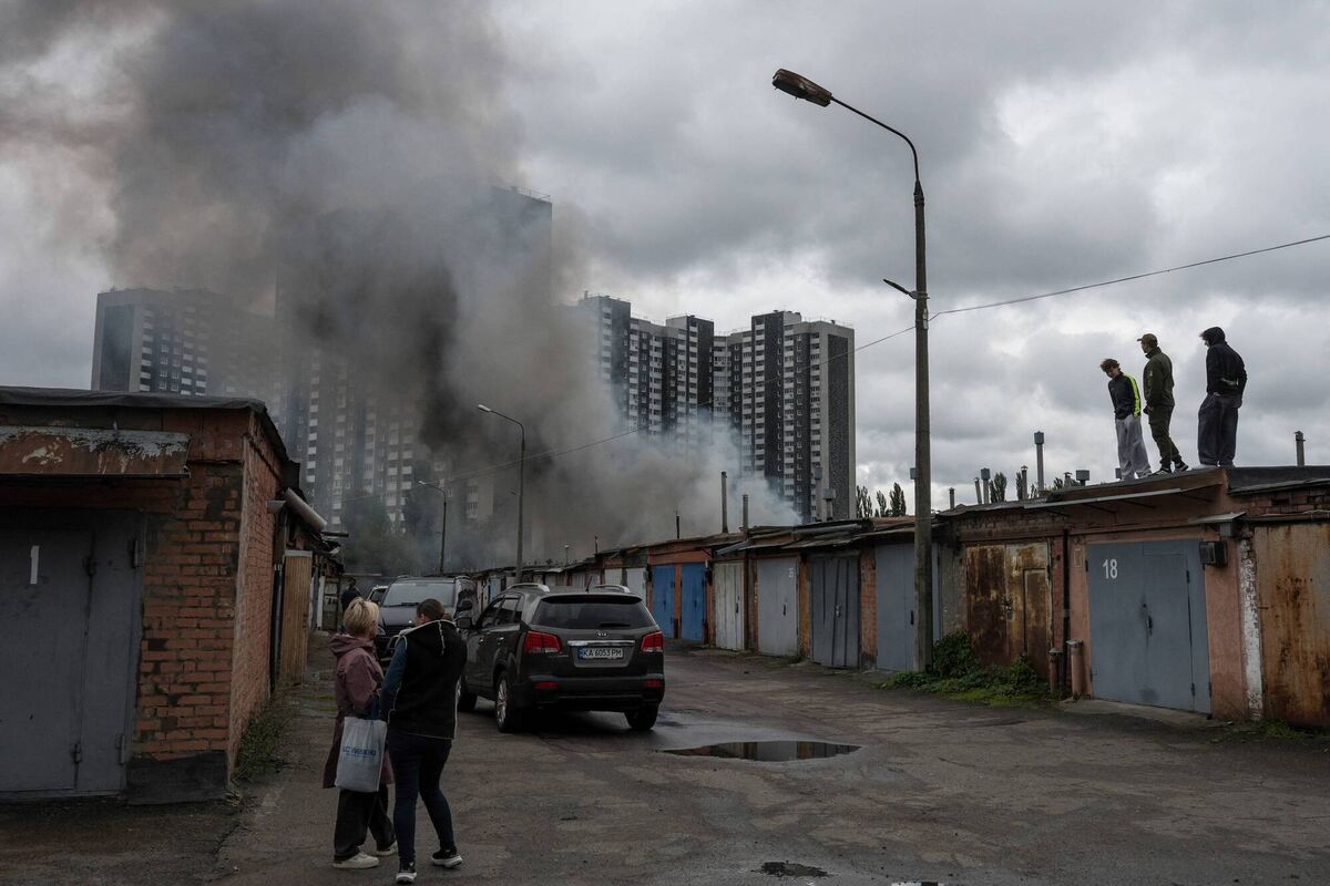 Local residents watch smoke rising above garages following an air attack in Kyiv on September 24, 2026, amid the Russian invasion of Ukraine. Picture: Vladyslav Musiienko / AFP via Getty Images Local residents watch smoke rising above garages following an air attack in Kyiv on September 24, 2026, amid the Russian invasion of Ukraine. Picture: Vladyslav Musiienko / AFP via Getty Images