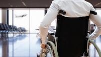 Disabled Adult People Travel In Wheelchair At Airport