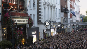 <p>U2 celebrate their 50th anniversary on the balcony of Bewley’s Cafe on Grafton street to thousands of fans. Picture: Sam Boal/Collins Photos </p>