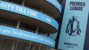 <p>BLUE HOURS: The Premier League trophy banner on display at the Etihad Stadium. Pic: Gary Oakley/PA</p>
