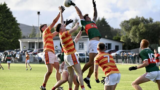 <p>HEAVY TRAFFIC: Thomas Clancy, Clonakilty gets a hand to the ball in the air against Newcestown in the McCarthy Insurance Group Cork Premier Senior Football Championship: Clonakilty vs Newcestown at Dunmanway. Picture: Larry Cummins</p>