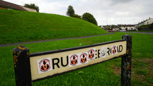 <p>Stickers on a road sign near the Garvaghy Road in Portadown, following the decision by the Parades Commission. Picture: Brian Lawless/PA</p>