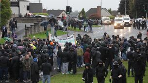 <p>Protesters block the Garvaghy road ahead of a Portadown District Loyal Orange Lodge march in the first parade along the Garvaghy Road in Portadown for almost 30 years, after the parade was given clearance in a late-night hearing. Picture: Peter Morrison/PA Wire</p> <p>Protesters block the Garvaghy road ahead of a Portadown District Loyal Orange Lodge march in the first parade along the Garvaghy Road in Portadown for almost 30 years, after the parade was given clearance in a late-night hearing. Picture: Peter Morrison/PA Wire</p>
