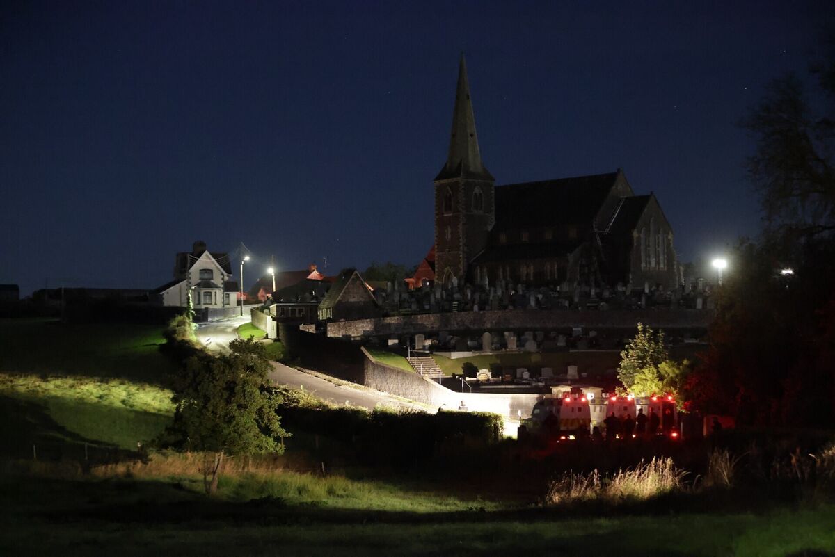 Police Land Rovers maintain a road block on the hill leading to Drumcree Church. Photo: Peter Morrison/PA Wire