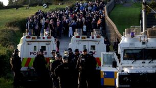 <p>Orange men gather near Drumcree Church as police form a barricade to prevent them entering the Garvaghy Road, where members of the Orange Order were due to take part in the first return parade on the road for almost 30 years. Photo: Peter Morrison/PA Wire</p>