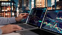 Stockbroker Monitoring Market Trends On Laptop