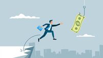 Businessman jumping towards dollar bill banknote on hook