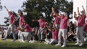 <p>Members of the US Team cheer on the 18th green during Sunday's Singles on day four of the Presidents Cup 2026 at Medinah Country Club  (Photo by Kevin C. Cox/Getty Images)</p>