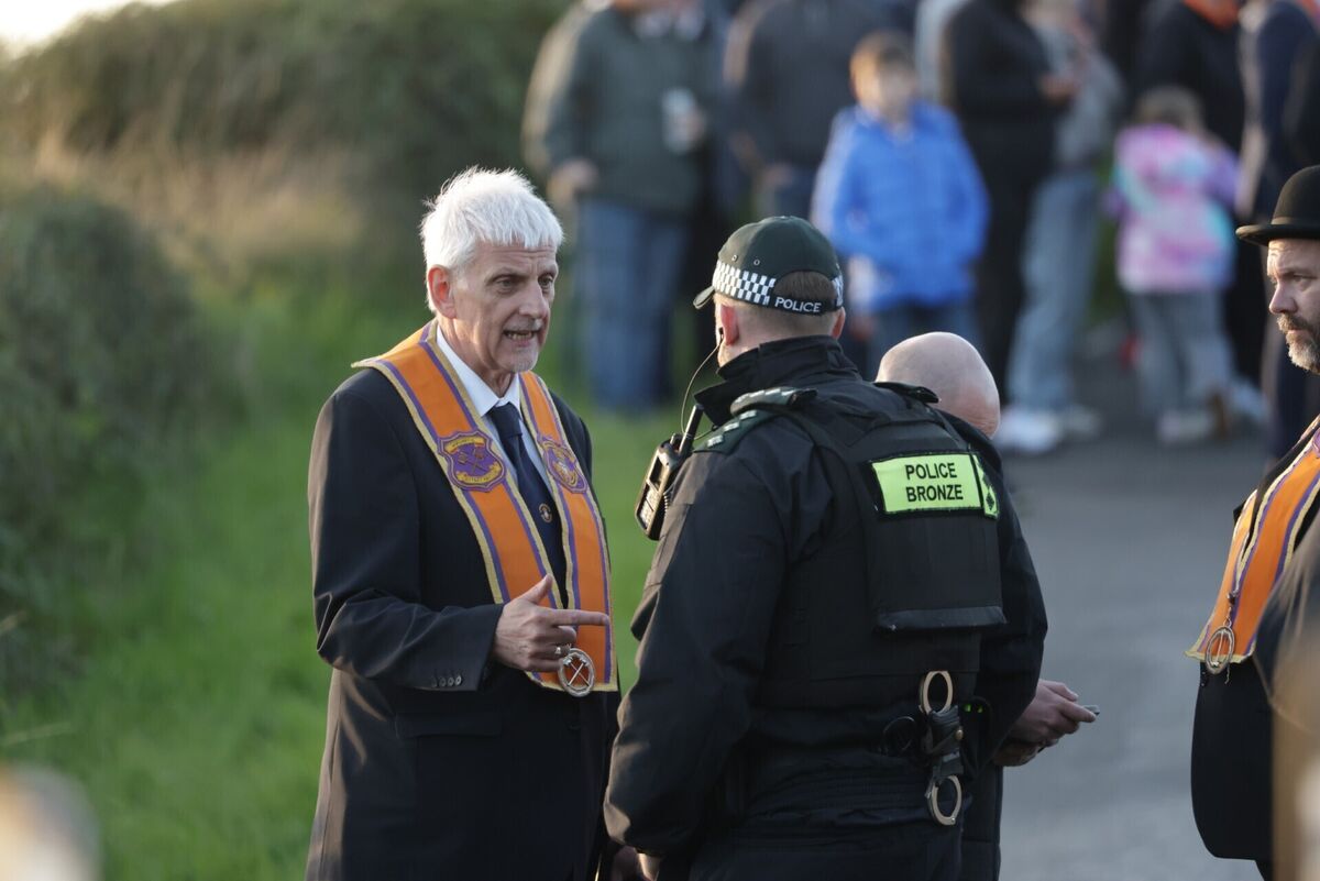 Nigel Dawson, Portadown district master, speaks to a police officer as the Orangemen gather at Drumcree Church. Nigel Dawson, Portadown district master, speaks to a police officer as the Orangemen gather at Drumcree Church.