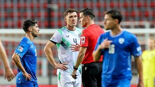 <p>Referee Harm Osmers speaks with Ireland's Dara O'Shea and Israel's Manor Solomon</p> <p>Referee Harm Osmers speaks with Ireland's Dara O'Shea and Israel's Manor Solomon</p>