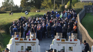 <p>Orangemen near Drumcree Church as police form a barricade to prevent them entering the Garvaghy Rd on Sunday. File picture: PA</p>