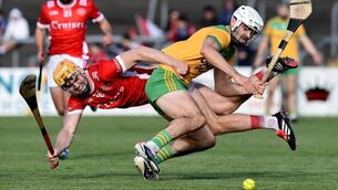 <p>Aidan McCarthy of Inagh Kilnamona in action against Rian Mulcahy of Éire Óg. Pic: John Sheridan/Sportsfile</p>