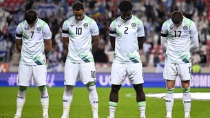<p>Republic of Ireland, players, from left, Troy Parrott, Adam Idah, James Abankwah and Jack Moylan, wearing black armbands in recognition for all the lives lost in the conflict in Gaza, bow their heads during the Israeli national anthem before the UEFA Nations League B match between Israel and the Republic of Ireland at Nagyerdei Stadion in Debrecen, Hungary. Photo: Stephen McCarthy/Sportsfile</p>