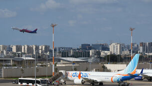 Passengers embark on a FlyDubai aircraft at Ben Gurion (Ariel Schalit/AP) Passengers embark on a FlyDubai aircraft at Ben Gurion (Ariel Schalit/AP)
