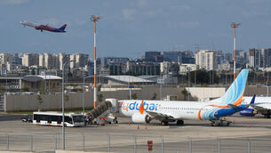<p>Passengers embark on a FlyDubai aircraft at Ben Gurion (Ariel Schalit/AP)</p>