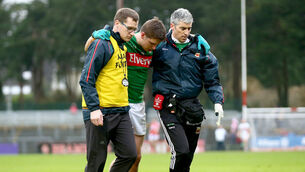 Lee Keegan is helped from the field by selector Tony McEntee and Dr. Sean Moffatt 31/1/2016