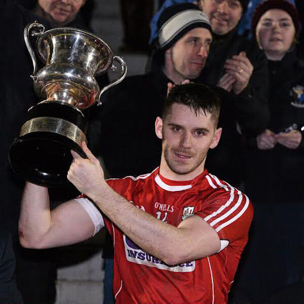 Cork captain Daniel Goulding lifting the McGrath Cup.