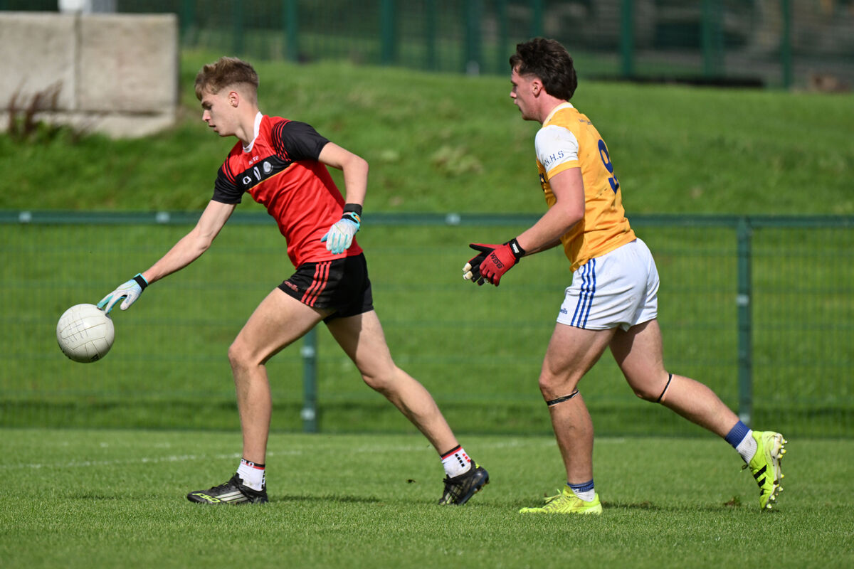 Sean Hogan, Coachford College, is tracked by Ewen Hourigan, Hamilton High School. Pic: Larry Cummins Sean Hogan, Coachford College, is tracked by Ewen Hourigan, Hamilton High School. Pic: Larry Cummins