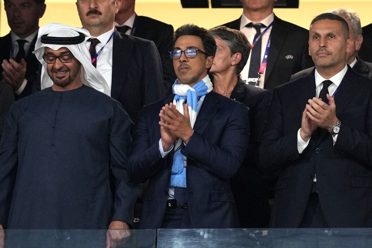 Manchester City owner Sheikh Mansour bin Zayed bin Sultan Al Nahyan, centre, and chairman Khaldoon Khalifa Al Mubarak, right. Pic: Martin Rickett/PA Wire