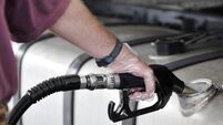 Man filling up the gas tank with gasoline