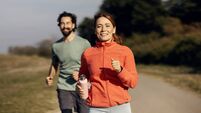 Couple jogging together enjoying healthy outdoor exercise