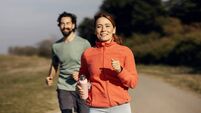 Couple jogging together enjoying healthy outdoor exercise