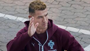 <p>TOPSHOT - Portugal's forward #07 Cristiano Ronaldo waves to fans as he arrives for a training session at Parken stadium in Copenhagen, Denmark, on September 30, 2026, on the eve of their Nations League Group A4 match against Denmark. Portugal captain Cristiano Ronaldo announced that he had left the team's training camp in Denmark following a press conference by coach Jorge Jesus. (Photo by Liselotte Sabroe / Ritzau Scanpix / AFP via Getty Images) / Denmark OUT</p>
