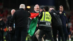 <p>A pitch invader is removed by security as he unveils a Palestine flag. Pic: Nick Elliott/Inpho</p> <p>A pitch invader is removed by security as he unveils a Palestine flag. Pic: Nick Elliott/Inpho</p>