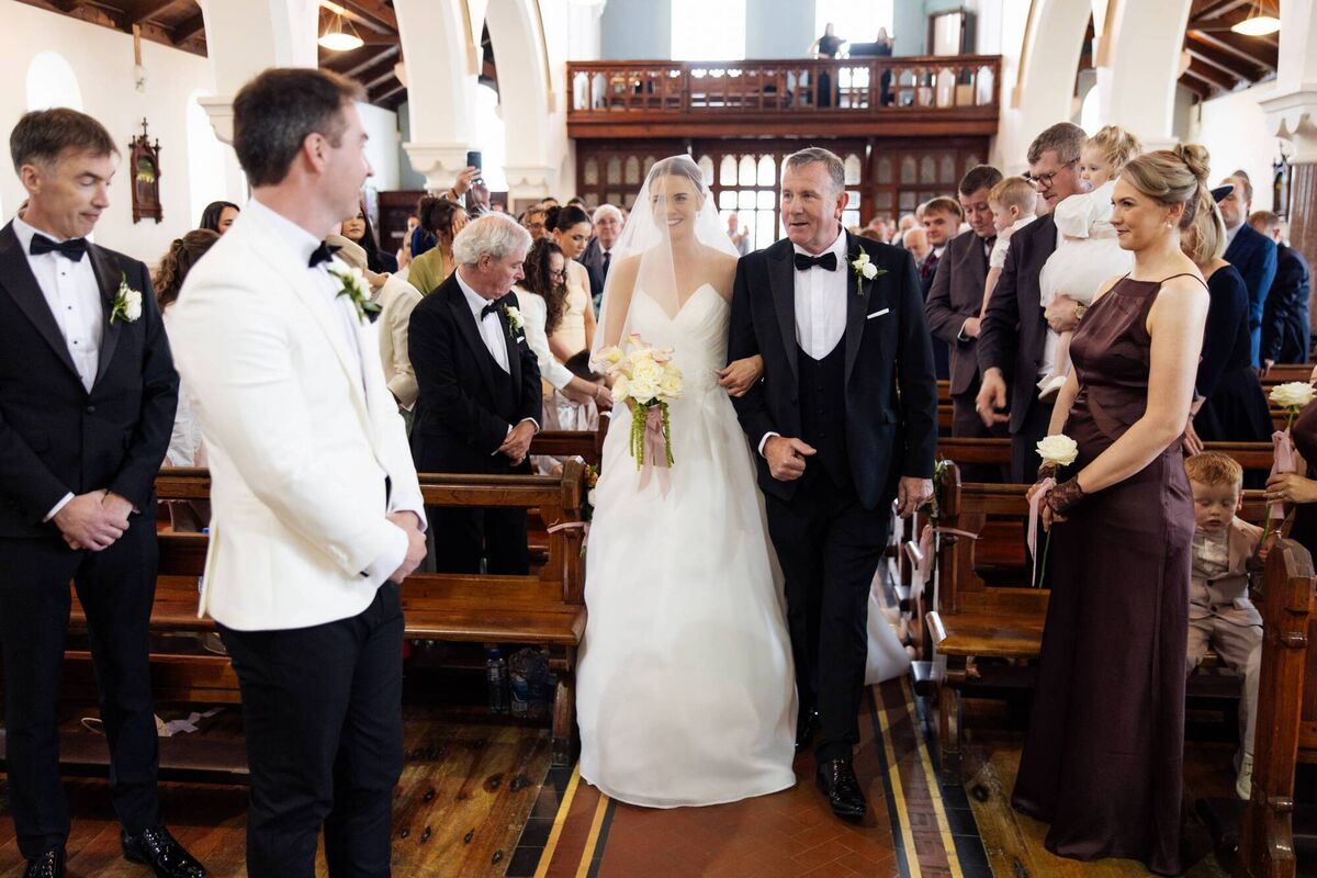 Bride Claire Dowling with her dad Bill Dowling and groom Mark Geary. Pictures: Matt Brooker Photography
