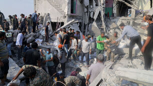<p>Rescue workers and residents search through the rubble in the aftermath of an Israeli-US strike on a girls' elementary school in Minab, Iran, in February. Among the children killed was six-year-old Fatemeh Yazdanpanah whose father, a poet, had chosen the school because she memorised his poems and he wanted an education worthy of her gifts. File photo: Abbas Zakeri/Mehr News Agency via AP</p> <p>Rescue workers and residents search through the rubble in the aftermath of an Israeli-US strike on a girls' elementary school in Minab, Iran, in February. Among the children killed was six-year-old Fatemeh Yazdanpanah whose father, a poet, had chosen the school because she memorised his poems and he wanted an education worthy of her gifts. File photo: Abbas Zakeri/Mehr News Agency via AP</p>