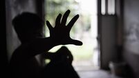 Child abuse concept, silhouette of  child confined in a dark room, prisoner or child abduction, child abuse human trafficking.
