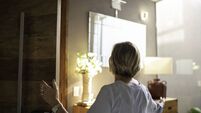 Mature woman opening door