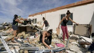 <p>People clean debris of a damaged house following a tornado in Pomas, southwestern France on August 25 that injured 39 people and damaged more than 300 homes. <span class="contextmenu emphasis CaptionCredit">Picture: Idriss Bigou-Gilles / AFP via Getty</span>
</p> <p>People clean debris of a damaged house following a tornado in Pomas, southwestern France on August 25 that injured 39 people and damaged more than 300 homes. <span class="contextmenu emphasis CaptionCredit">Picture: Idriss Bigou-Gilles / AFP via Getty</span>
</p>