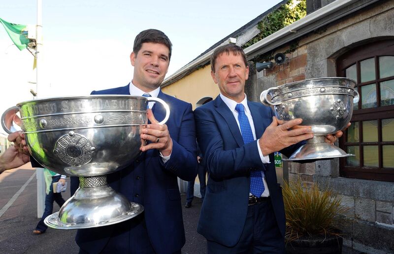 Fitzmaurice with the Sam Maguire Cup and then Kerry minor manager Jack O'Connor with the Tom Markham Cup in 2014. Pic: Eamonn Keogh