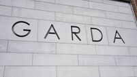 iStock-1427706690.jpg Garda sign on building