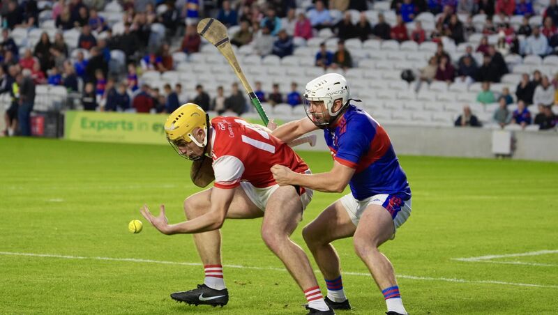 Watergrasshill’s Seán Desmond catches a high ball as he escapes a tackle from Cian O’Connor of Erin’s Own. Pic: Noel Sweeney. Watergrasshill’s Seán Desmond catches a high ball as he escapes a tackle from Cian O’Connor of Erin’s Own. Pic: Noel Sweeney.