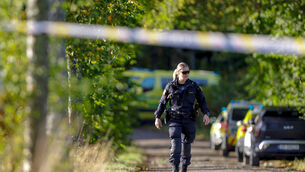 Emergency services secure the site after a person opened fire against a group of people, in Halden, Norway (Christoffer Andersen/NTB Scanpix/AP)