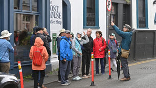 <p>Tourists getting a guided tour of Kinsale. Cork County Council municipal district officer for Bandon-Kinsale Brian Dunne outlined the welcome extended to visitors including a showcase of Irish traditional music song and dance on the pier. File picture: Dan Linehan</p>