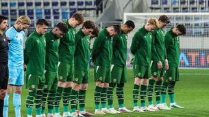 <p>The Republic of Ireland team, wearing black armbands in recognition for all the lives lost in the conflict in Gaza, bow their heads during the Israeli national anthem before the UEFA Nations League B match between the Republic of Ireland and Israel at TSC Arena in Bačka Topola, Serbia. Photo by Luka Milosavljevic/Sportsfile</p>
