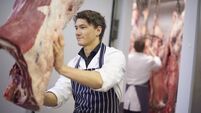 young butcher in the meat room