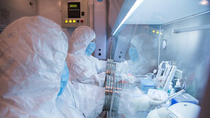 Institute workers in a lab (The Irkutsk Anti-Plague Research Institute of Siberia and Far East via AP)