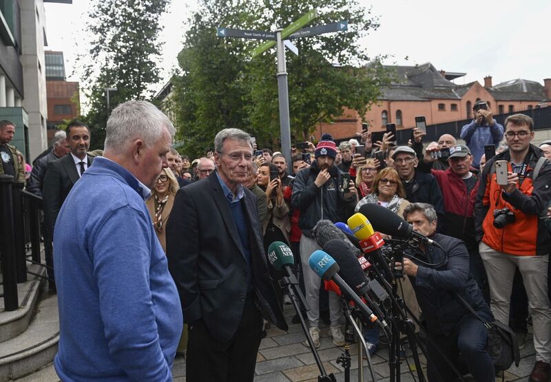 Breandan Mac Cionnaith and members of the Garvaghy Road Residents coalition speak to the media outside the High Court in Belfast following a reserved judgment. Picture: Mark Marlow/PA