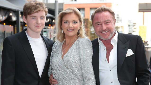<p>Niamh Flatley with husband Michael Flatley and son Michael St James arrive at the premiere screening of Michael Flatley's film 'Blackbird' in 2022. Picture: Brian McEvoy </p>