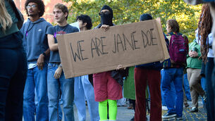A demonstrator holds a sign reading ‘WE ARE JANE DOE’ during a protest against Cornell University’s handling of the 2024 fraternity-house gang rape allegations (Adrian Kraus/AP) A demonstrator holds a sign reading ‘WE ARE JANE DOE’ during a protest against Cornell University’s handling of the 2024 fraternity-house gang rape allegations (Adrian Kraus/AP)