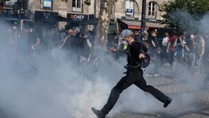 <p>A protestor kicks a tear gas canister away during a demonstration part of a nationwide day of actions called by high-school students, joined by unions and teachers, who for days have been demanding better learning conditions in protests punctuated by violent confrontations in Nantes, western France, on October 6, 2026. Picture:  Sebastien Salom-Gomis / AFP via Getty Images</p>