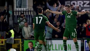 <p>Ireland's Tommy Lonergan celebrates with Oisín Gallagher after he scores his side's third. Pic: Nick Elliott/Inpho</p>