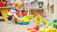 Child playing with colorful toys at the learning center or in kindergarten