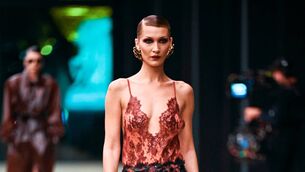 <p>US model Bella Hadid presents a creation for Saint Laurent for the Women's Ready to Wear Fall/Winter 2026-2027 collection fashion show as part of the Paris Women Fashion Week, in Paris, on March 3, 2026. (Photo by JULIEN DE ROSA / AFP via Getty Images)</p>