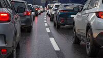 Traffic jam with a row of cars on a highway during rush hour in the evening after work. red brake lights of stopped cars on the